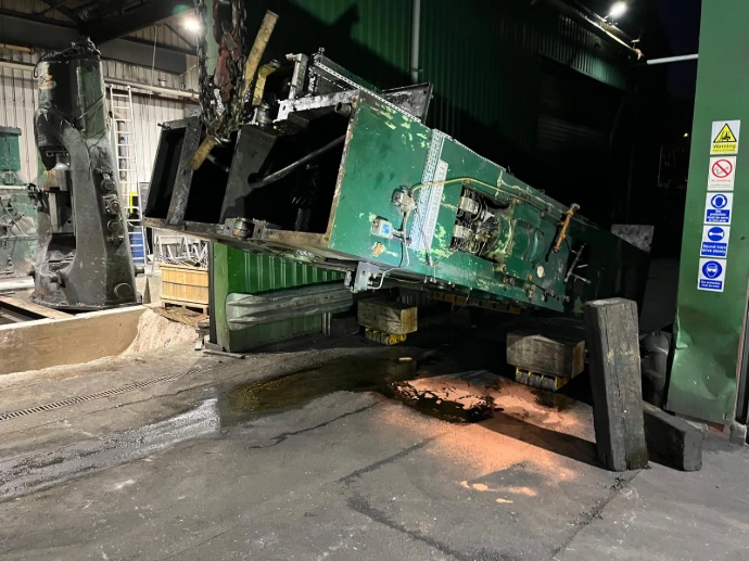 CNC machine being moved through tight space